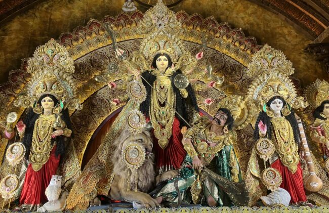 Ornate golden idol of the Goddess Maa Durga.